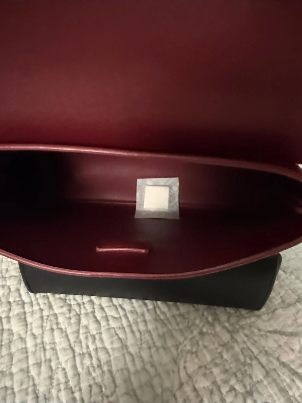 Source Unknown sleek burgundy